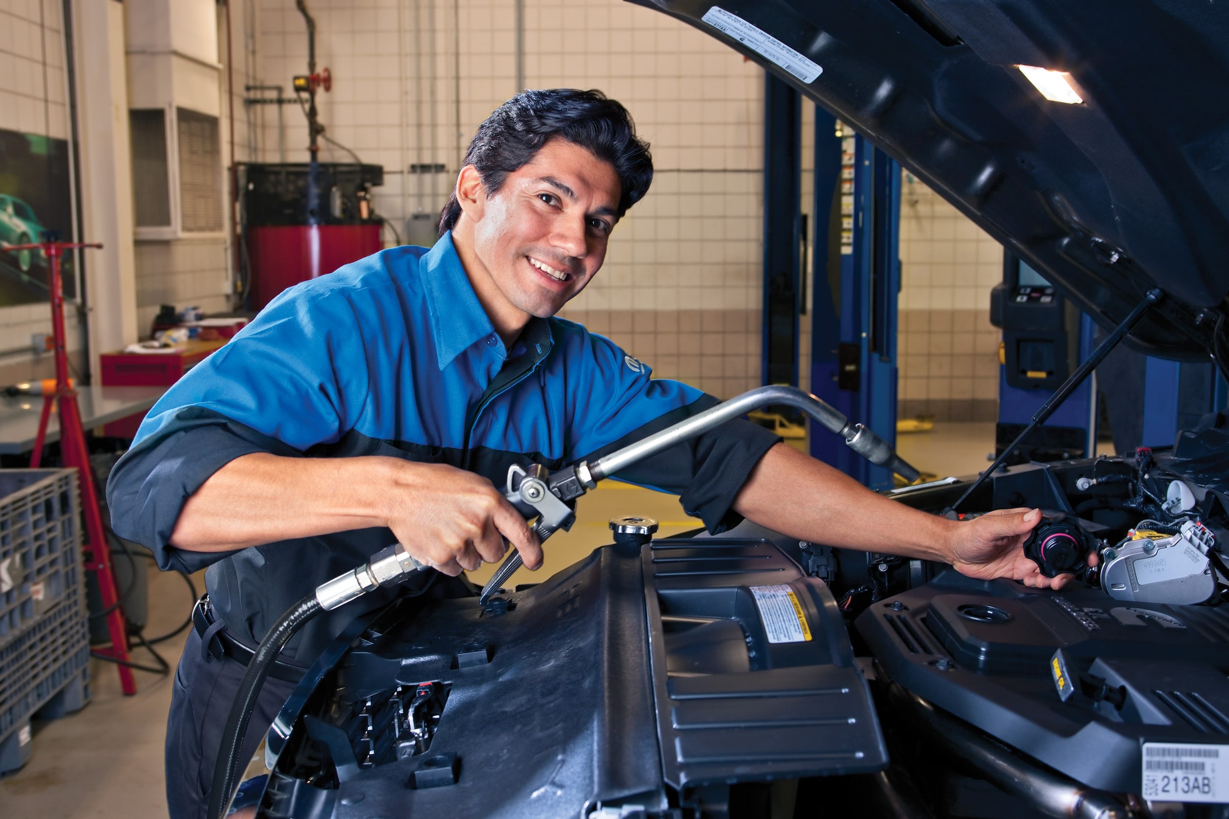 Certified Pre-Owned vehicle undergoing a multi-point inspection by factory-trained technicians