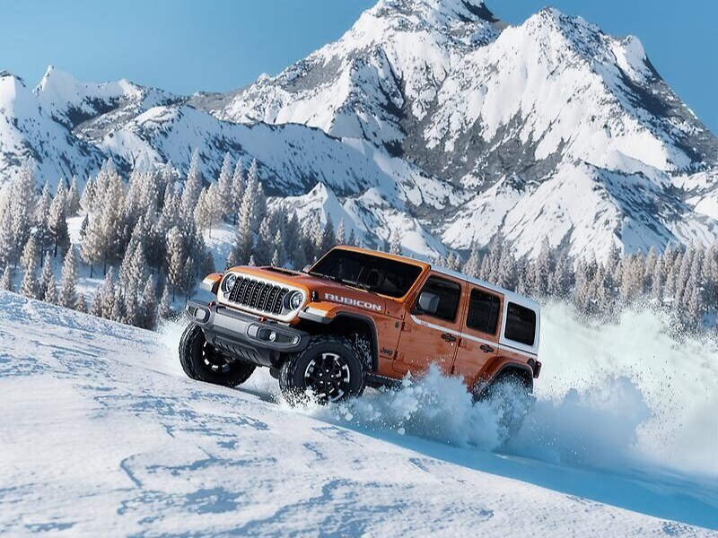 2026 Jeep Wrangler displaying its superior 4x4 systems on slippery snow