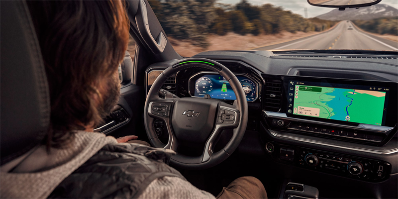 Man Driving 2026 Chevrolet Silverado 1500 Using GPS Tech Feature