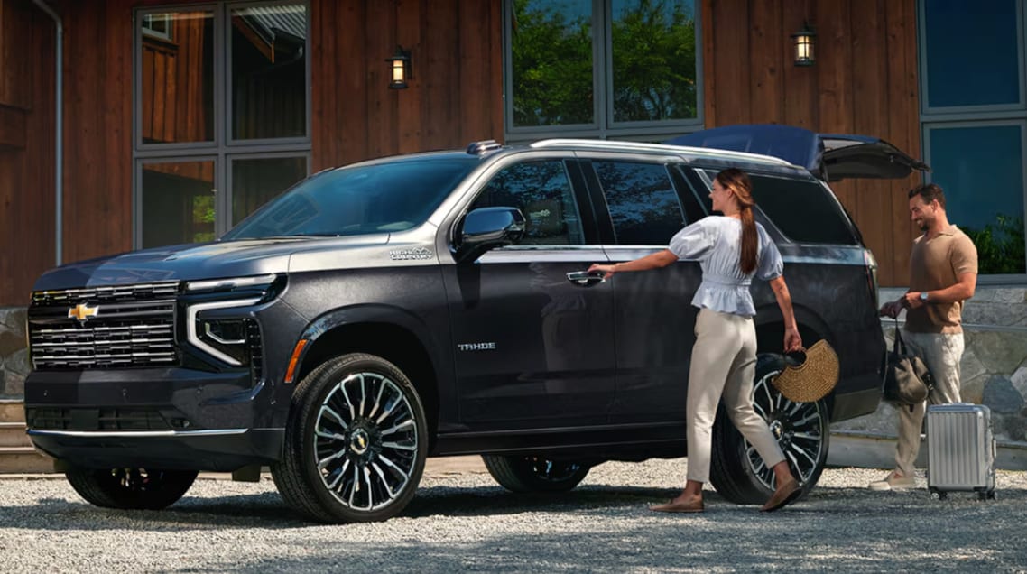 2026 Chevrolet Tahoe with Couple opening doors