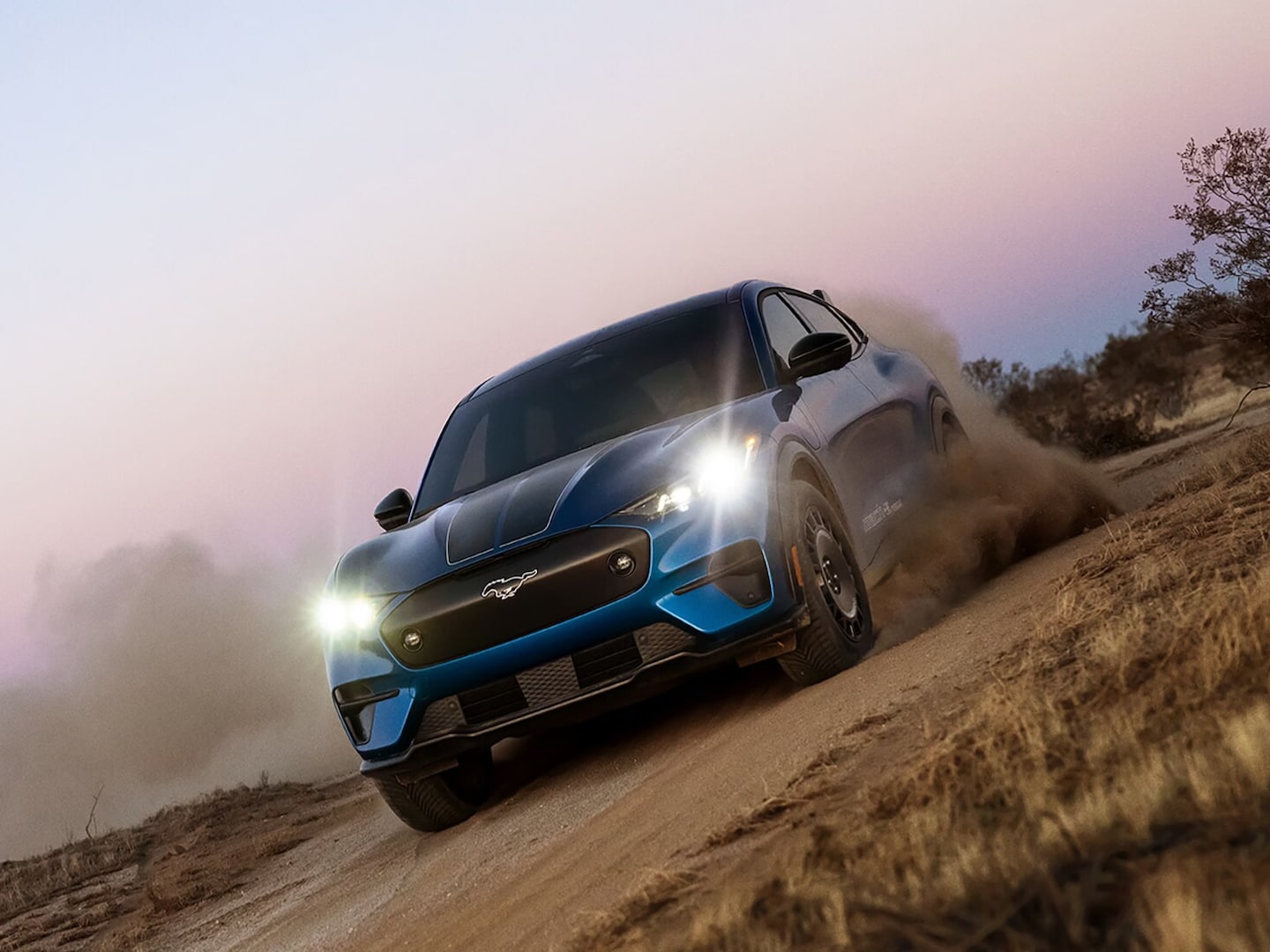 2026 Mustang Mach-E demonstrating its performance on a rugged trail