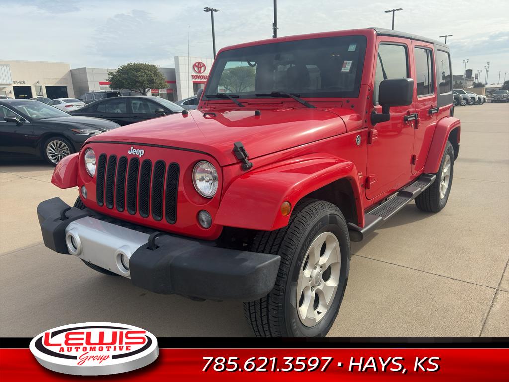 Used 2015 Jeep Wrangler Unlimited Sahara with VIN 1C4HJWEG4FL603808 for sale in Hays, KS