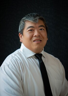 Staff member Garret Fong from a1c11bb0802a