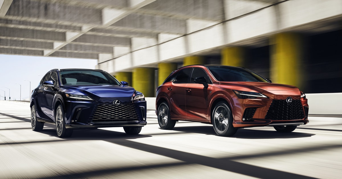 Two Lexus RX vehicles driving through the highway
