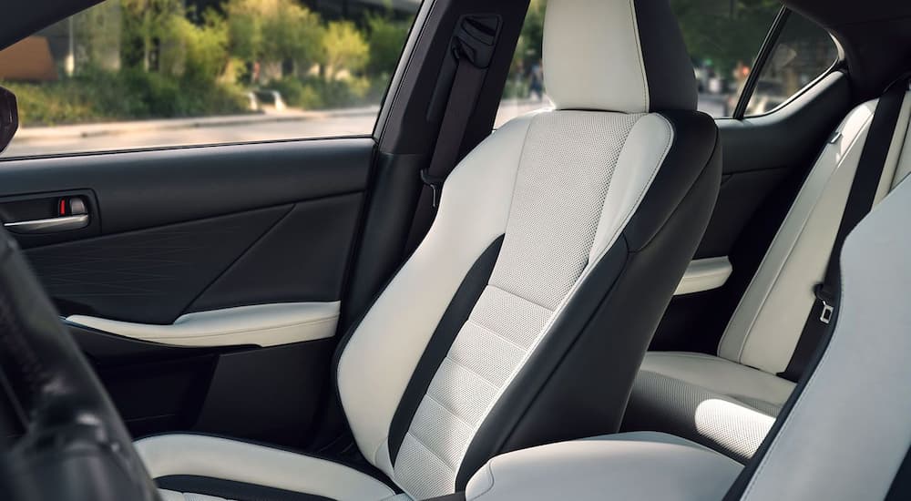 The black and white interior of a 2024 Lexus IS is shown.