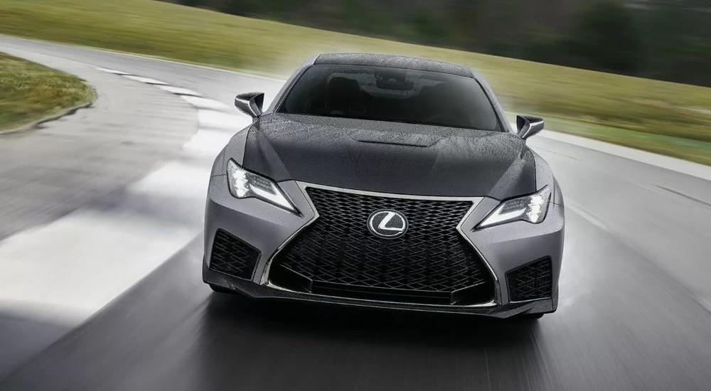 A grey 2023 Lexus RC F is shown from the front on a racetrack.