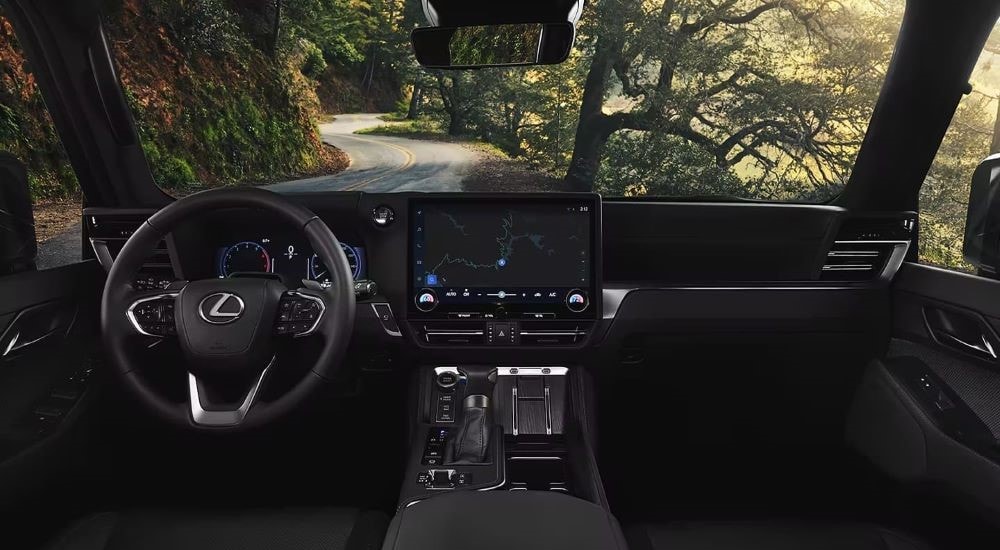 A close up shows the black dash and infotainment screen in a 2024 Lexus GX.