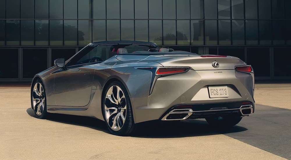 A silver 2023 Lexus LC500 is shown from the rear at an angle after leaving a used Lexus dealership.