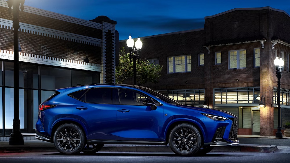 2025%20Lexus%20NX%20350%20F%20Sport%20Hybrid%20-%20Blue.jpg A blue 2025 Lexus NX 350 F Sport Hybrid is shown parked at night.