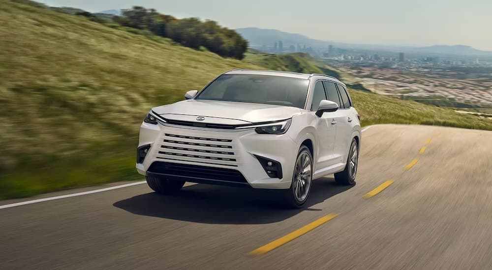 Lexus%20dealer%20near%20Great%20Neck%20-%202023%20Lexus%20TX%20-%20Drive.jpg A white 2024 Lexus TX driving up a hill from a Lexus dealer near Great Neck.
