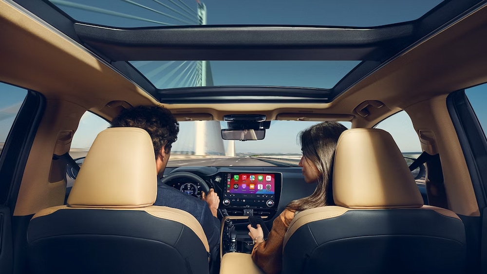 2025%20Lexus%20NX%20450%2BAWD%20Hybrid%20-.jpg The brown and black interior and dash is shown in a 2025 Lexus NX 450+ AWD Hybrid.