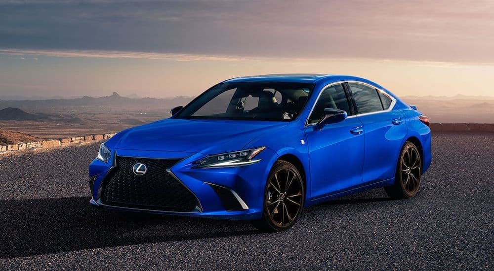 A blue 2023 Lexus ES is shown from the front at an angle.