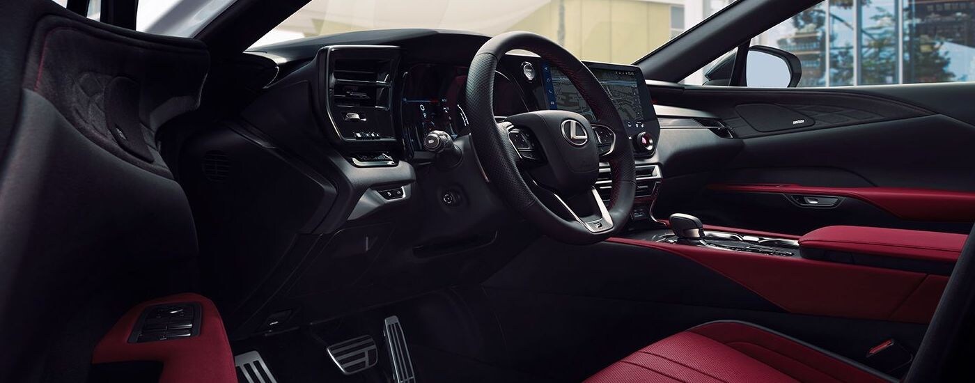 The red and black upholstery in the cabin of a 2024 Lexus RX.