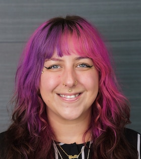 Staff member Kacey Glocksine from fe595ec01bec