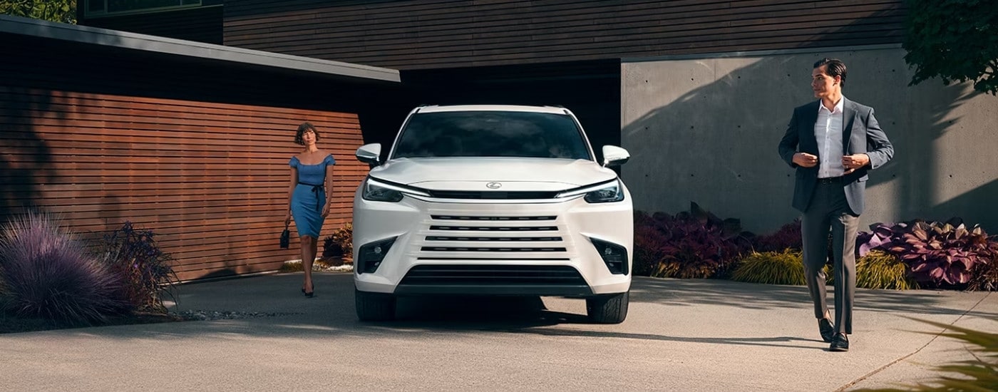 A white 2025 Lexus TX 350 parked on a driveway.