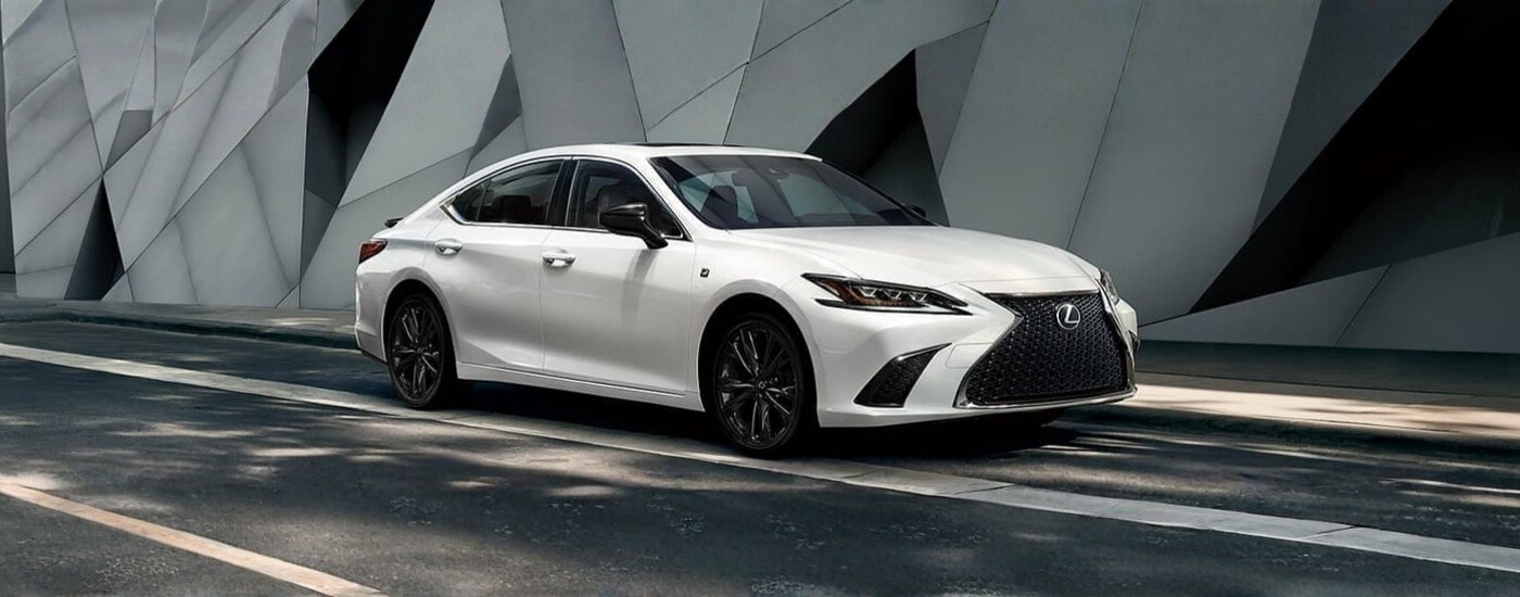 White 2021 Lexus ES parked in front of a modern wall