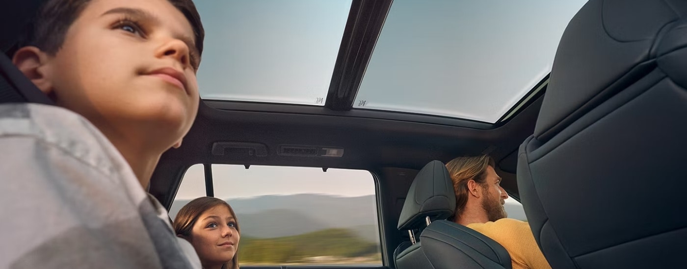 People in a 2025 Lexus TX 500h F SPORT