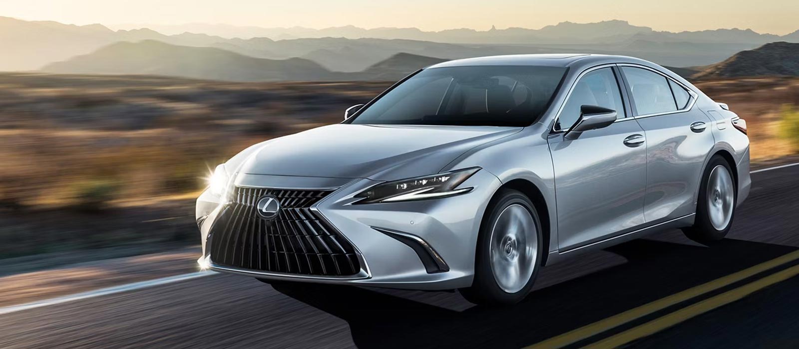 2025 Lexus ES driving on a desert road