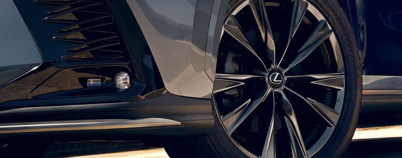 A close up shows the wheel on a silver 2024 Lexus NX.