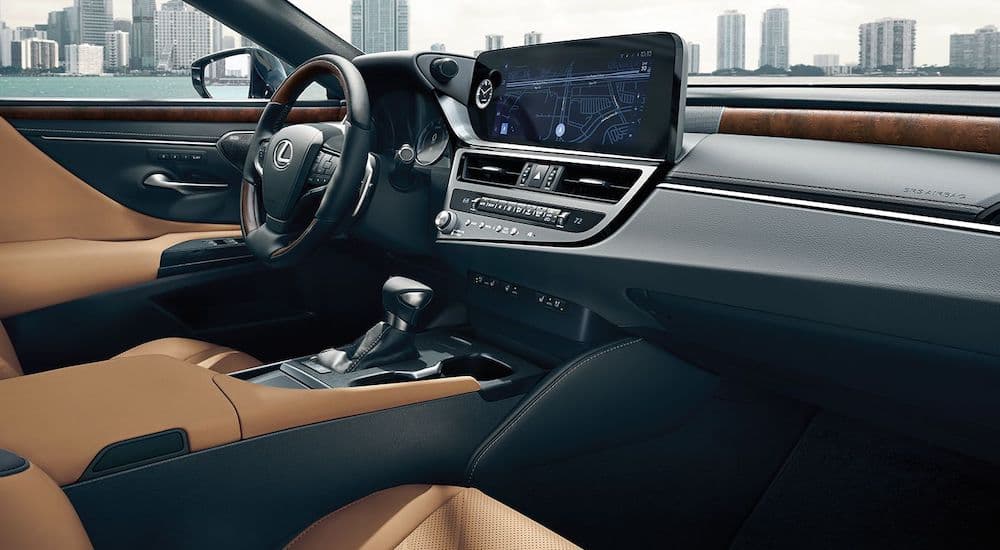 The brown interior of a 2024 Lexus ES300 is shown from the passenger side.