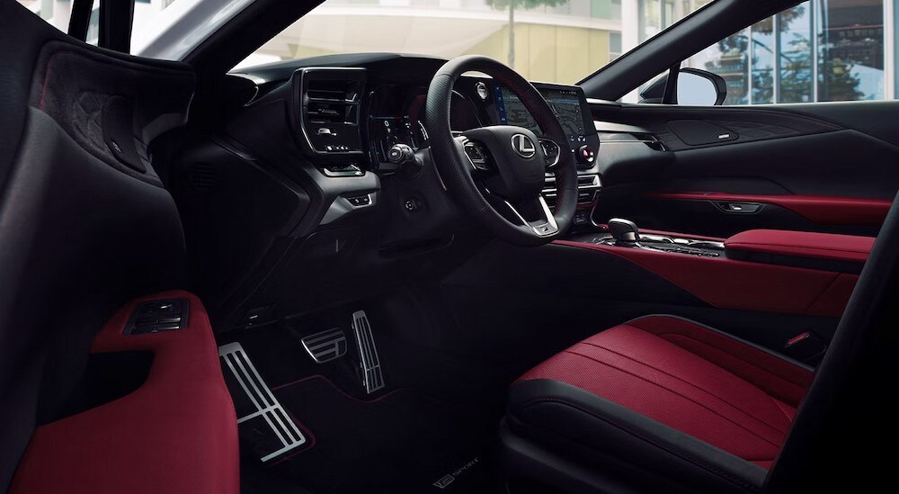 The black and red interior and dash in a 2024 Lexus RX is shown.