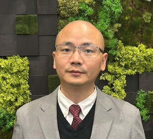 Staff member Sam Zheng from 836245ad3943