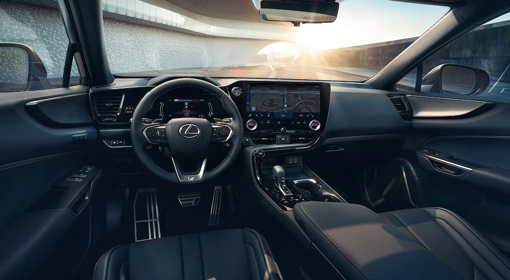 2024%20Lexus%20NX%20450h%2BF%20Sport%20-%20Interior.jpg The black interior and dash in a 2024 Lexus NX 450h+F Sport is shown.