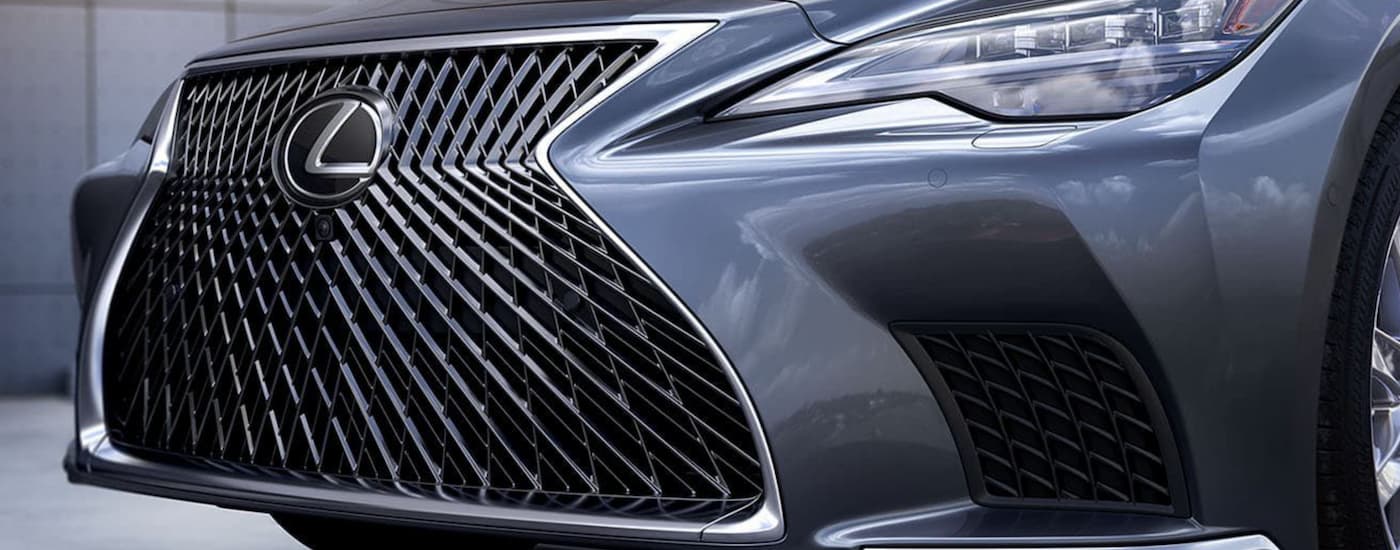 A close up of the grille on a dark grey 2023 Lexus LS is shown.