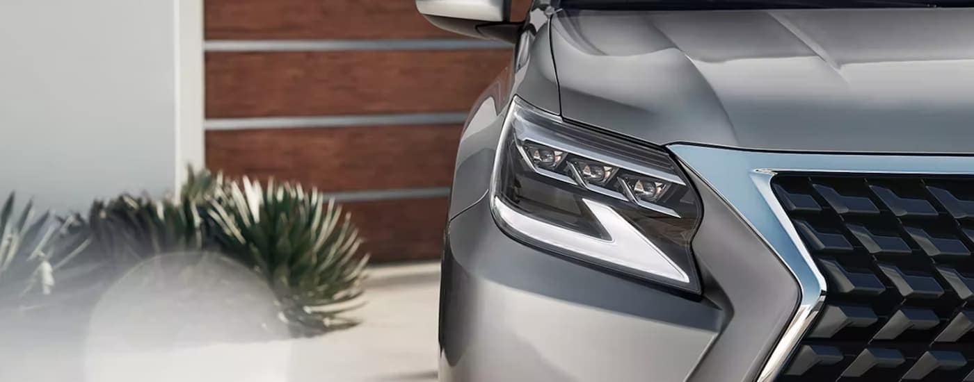 A close up of the headlight on a silver 2023 Lexus GX is shown.