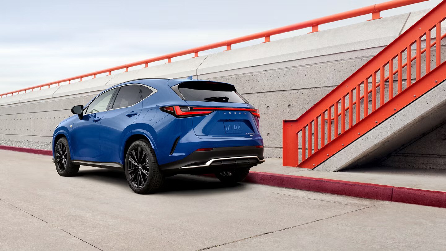 blue lexus nx driving on a race track