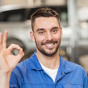 A Good Local Car Mechanic giving OKAY sign