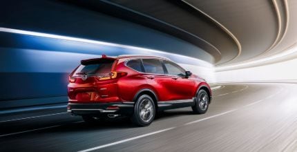 red Honda CR-V driving in a tunnel