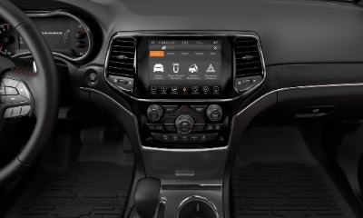 Jeep Grand Cherokee interior showing center console with touchscreen