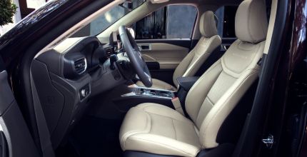 interior shot of a Ford Explorer showing front two seats from the driver's side door