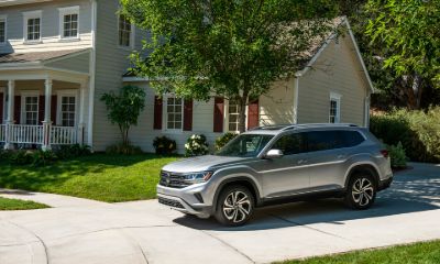 Silver VW Atlas parked outside of a home
