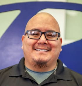 Staff member Andres Casas from ID_6a19ee04ed2c