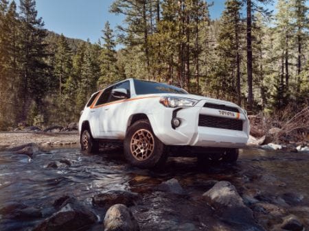 Silver Toyota 4Runner driving off-road