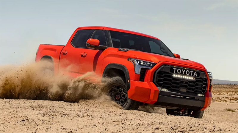 2022 Toyota Tundra TRD Pro CrewMax shown in Solar Octane. Model shown available March 2022; other models available December 2021.