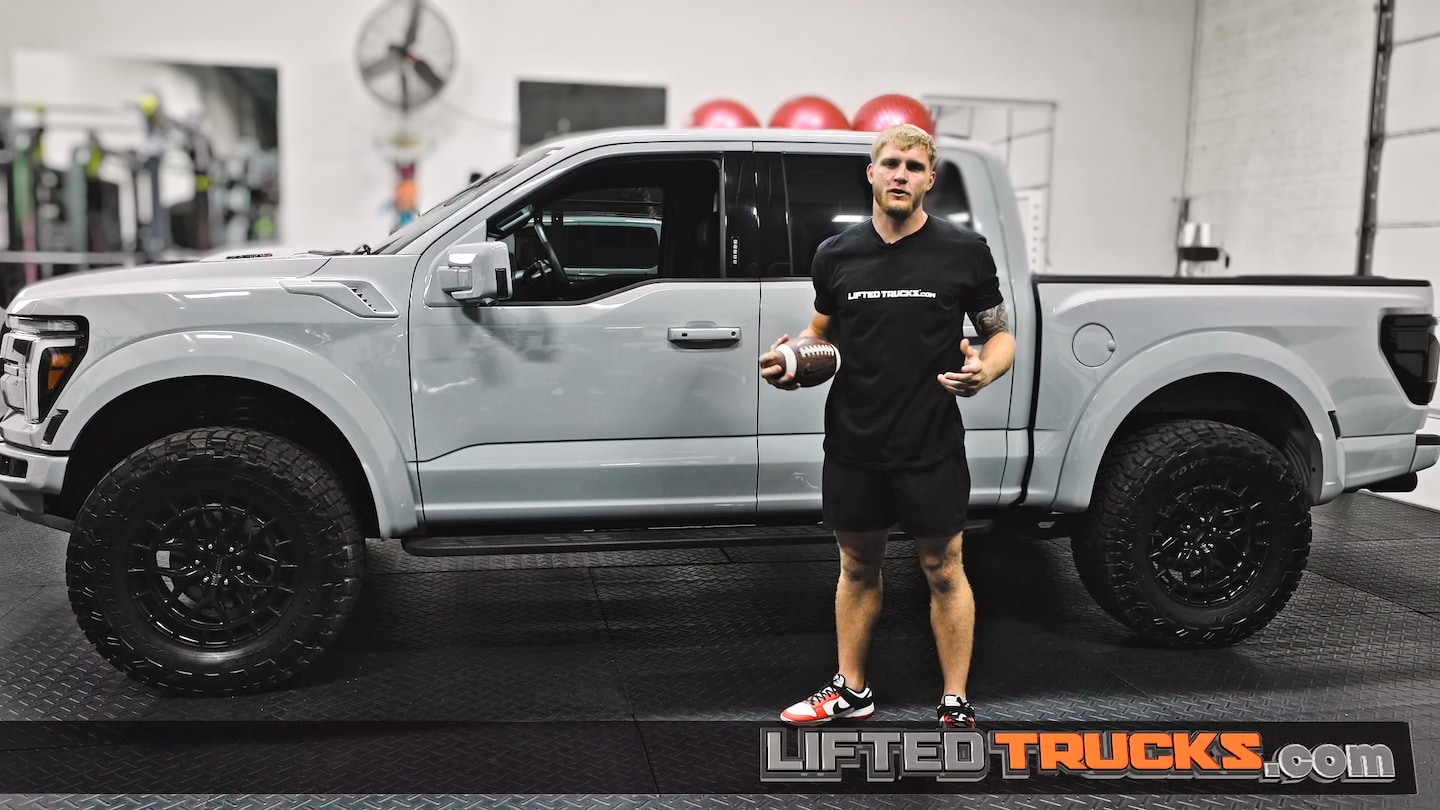 Trey McBride standing in front of his Ford Raptor R
