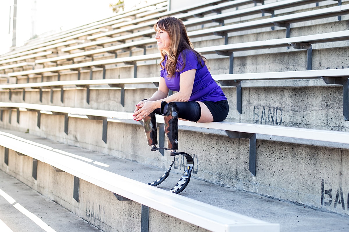  Jami Marseilles sitting in some bleachers