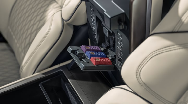 Digital Scent cartridges are shown in the diffuser located in the center arm rest.