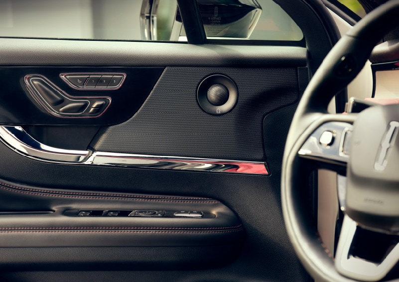 A RevelĀ® audio speaker is shown in the driverās side door of a 2025 Lincoln CorsairĀ® SUV.