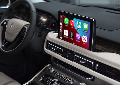 The SYNC® AppLink® screen is shown in the center screen of a 2023 Lincoln Aviator® Grand Touring Plug-in Hybrid model.
