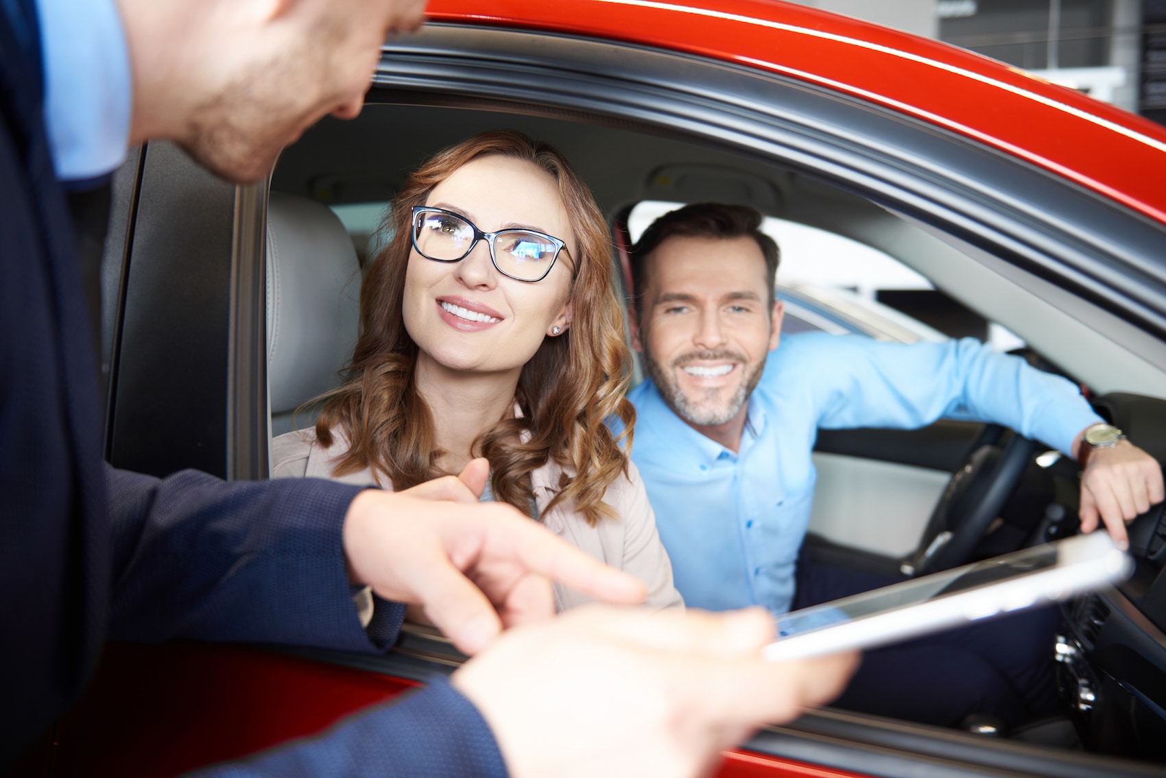 defining APR at Lincoln of New Bern in New Bern | Sales agent explain information to couple at a dealership