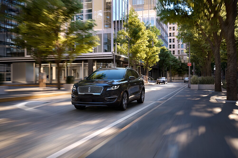 Lincoln of New Bern is a luxury car dealership near Oriental NC | 2020 Lincoln MKC driving on road