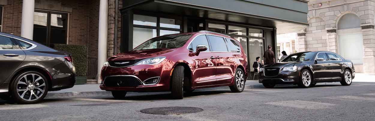 Chrysler Pacifica parked ahead of Chrysler 300