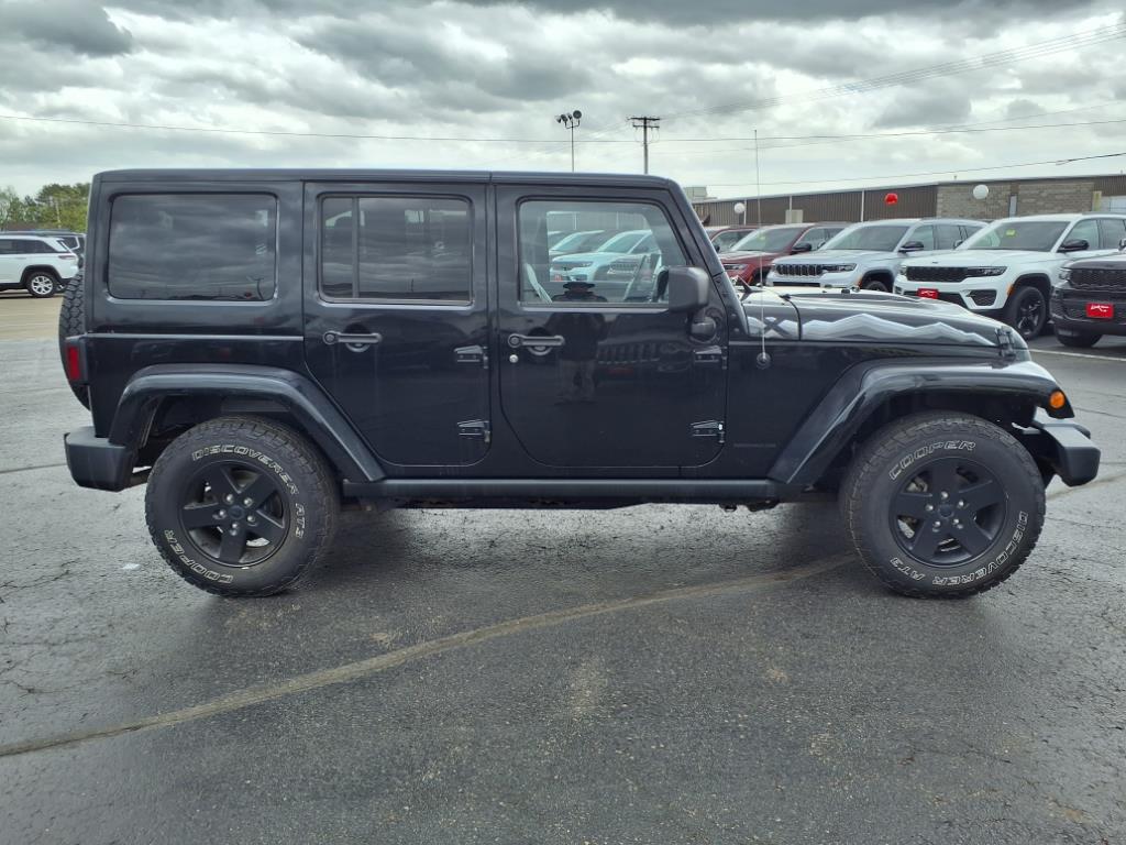 Used 2015 Jeep Wrangler Unlimited Sahara with VIN 1C4BJWEG7FL594673 for sale in Rice Lake, WI