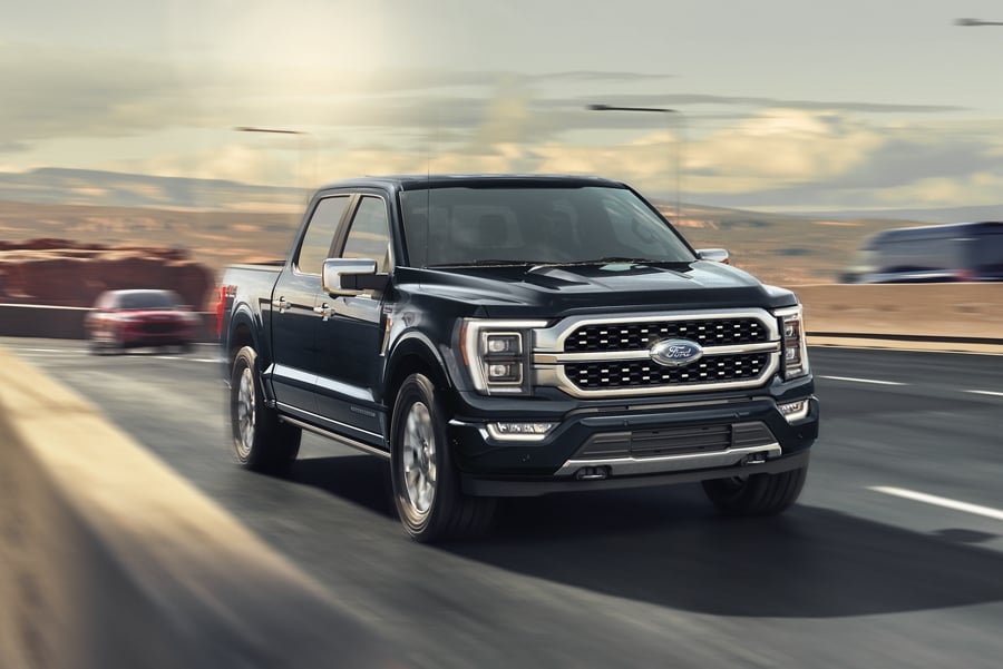 black Ford truck driving