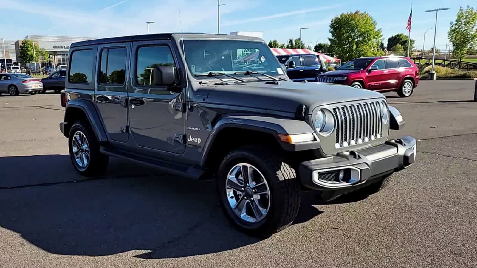 Used 2022 Jeep Wrangler Unlimited Sahara with VIN 1C4HJXEN9NW250502 for sale in Medford, OR