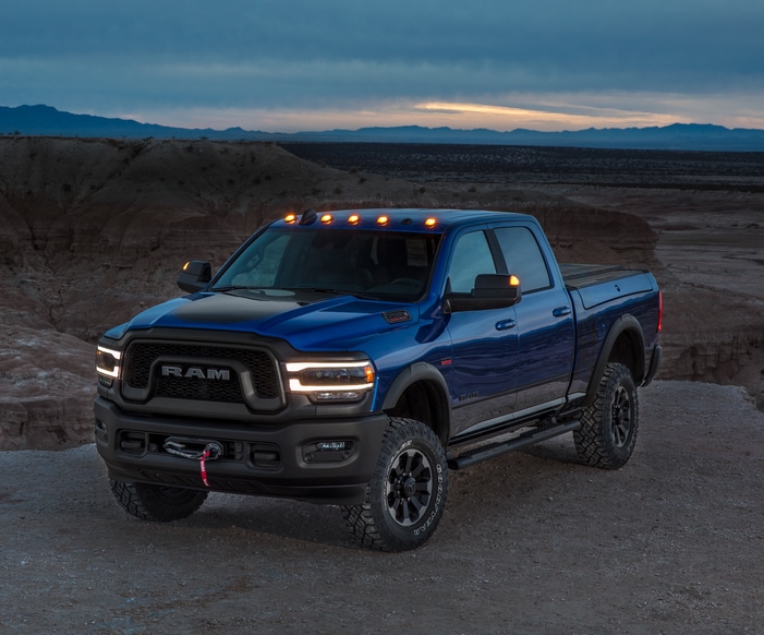 blue Ram 2500 Power Wagon truck parked on a ledge